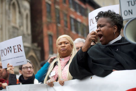 Interfaith clergy leaders protest outside the Center City Starbucks, where two black men were arrested, in Philadelphia, Pennsylvania U.S. April 16, 2018. REUTERS/Mark Makela