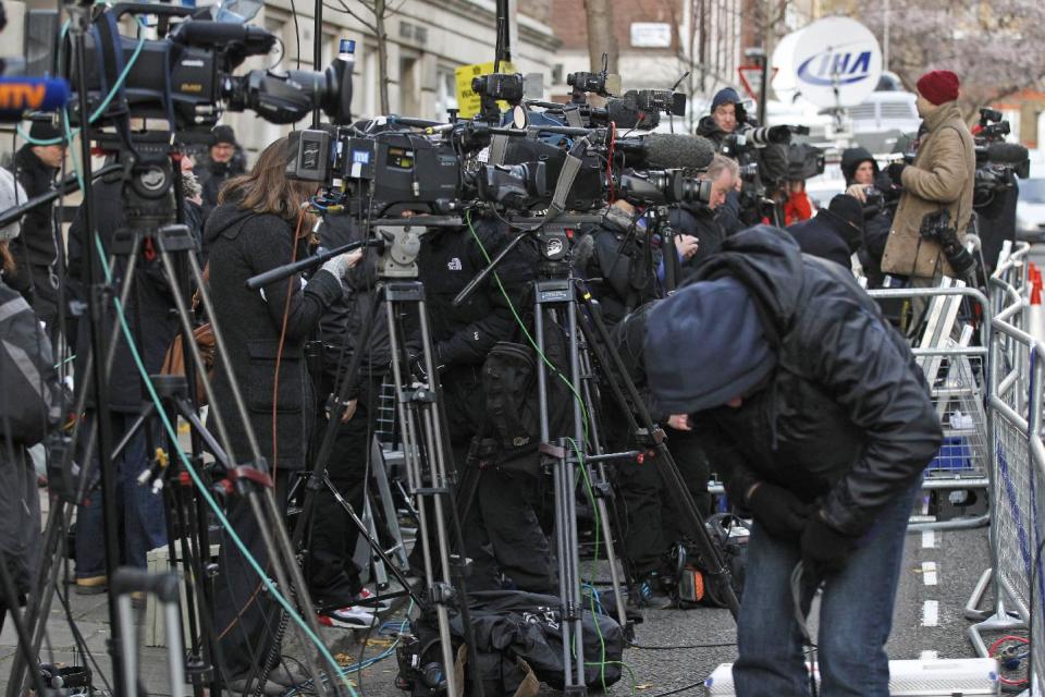 Media gather outside the King Edward VII hospital in central London where Kate, the Duchess of Cambridge has been admitted with a severe form of morning sickness, Tuesday, Dec. 4, 2012. Prince William and his wife Kate are expecting their first child, it was announced Monday. The Duchess of Cambridge is suffering from a severe form of morning sickness in the early stages of her pregnancy, and is widely expected to stay in hospital for several days. (AP Photo/Sang Tan)