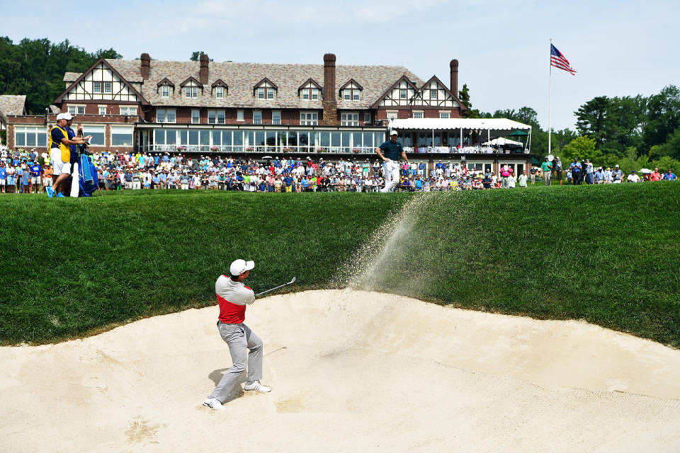 <p>Jason Day of Australia plays a shot from a bunker on the 18th hole during the first round of the 2016 PGA Championship at Baltusrol Golf Club on July 28, 2016 in Springfield, N.J.. (Photo: Stuart Franklin/Getty Images)</p>
