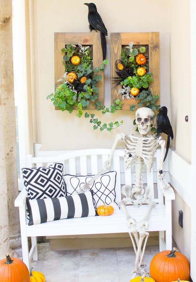 <p>If you've got a bench or rocking chair — or even just a tall stack of pumpkins — sit a skeleton down and affix a crow to his shoulder. You can even put a bowl of candy on the skeleton's lap if you'd like. </p><p><em><a href="https://designimprovised.com/2015/10/5-steps-to-spooky-halloween-front-porch.html" rel="nofollow noopener" target="_blank" data-ylk="slk:Get the tutorial at Design Improvised »;elm:context_link;itc:0;sec:content-canvas" class="link ">Get the tutorial at Design Improvised »</a> </em></p>