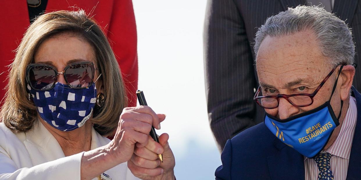 Nancy Pelosi Chuck Schumer holding pen