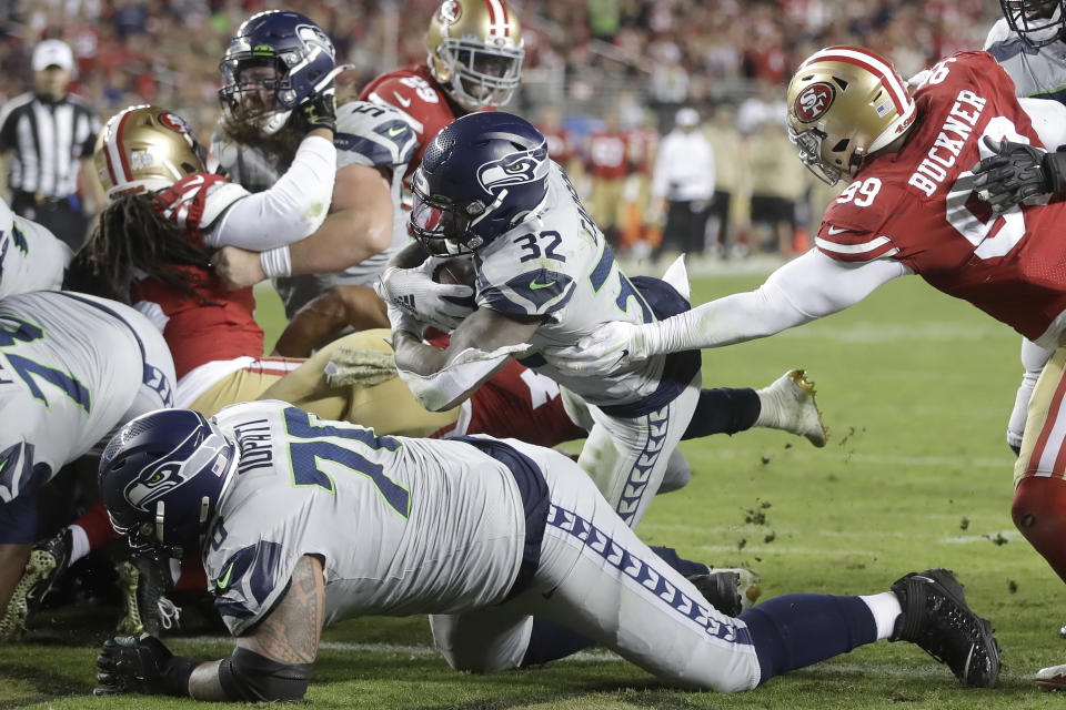 Seattle Seahawks running back Chris Carson (32) runs for a touchdown against the San Francisco 49ers during the second half of an NFL football game in Santa Clara, Calif., Monday, Nov. 11, 2019. (AP Photo/Ben Margot)