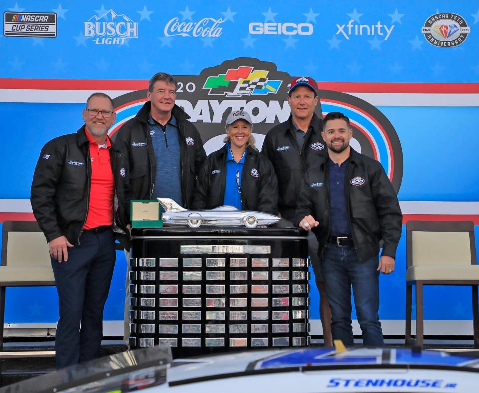 From left: Crew chief Mike Kelly, team co-owners Tad Geshickter, Jodi Geshickter and Gordon Smith, and driver Ricky Stenhouse, posing Monday morning with the Harley J. Earl Trophy.