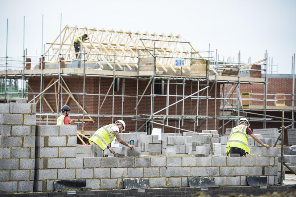 Builders lay blocks on a building site near Bristol, as a new report found that Britain's chronic brick shortage is ramping up house prices and the situation could be made worse by the Brexit vote.