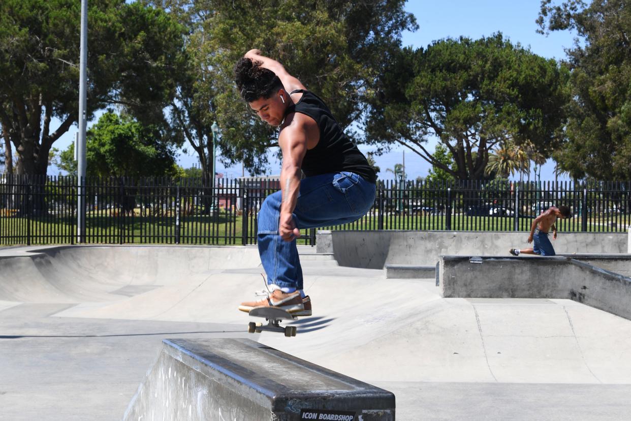 Sam Castro, 21, ollies onto a corner rail at Bedford Pinkard Skate Park in Oxnard on Thursday.