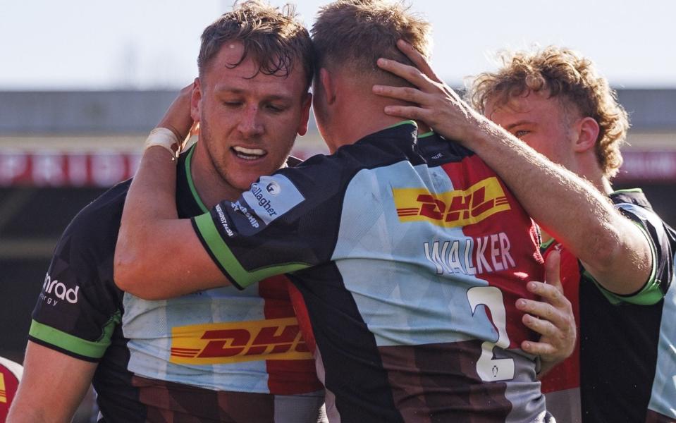 Alex Dombrandt celebrates scoring a try for Harlequins