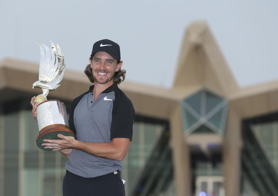 Tommy Fleetwood of England holds the trophy after he won the Abu Dhabi Golf Championship, in Abu Dhabi, United Arab Emirates, Sunday, Jan. 22, 2017. (AP Photo/Kamran Jebreili)