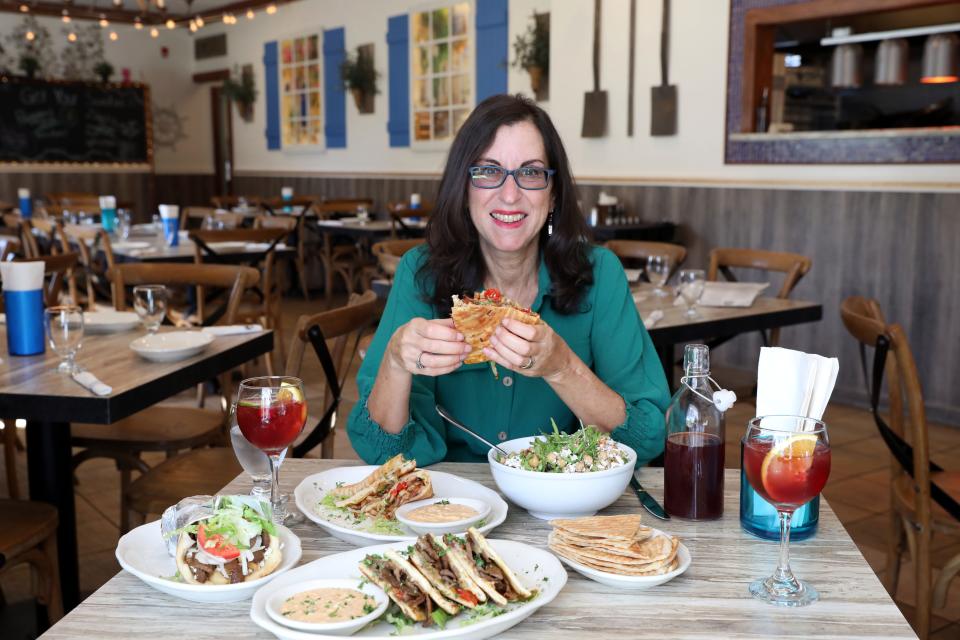 Lohud food and dining reporter Jeanne Muchnick tries the Marcos, a Greek style quesadilla, at Pappous Greek Kitchen in Yorktown Heights Oct. 26, 2023.