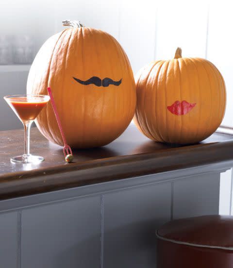 <p>You can use a permanent marker and lipstick to pull off this minimalist pumpkin look that's sure to get you a few compliments. </p>