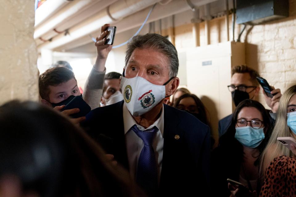 Sen. Joe Manchin, D-W.Va., speaks to reporters as he leaves a private meeting with Sen. Kyrsten Sinema, D-Ariz., White House domestic policy adviser Susan Rice, Director of the National Economic Council Brian Deese, and other White House officials on Capitol Hill in Washington on Sept. 30, 2021.