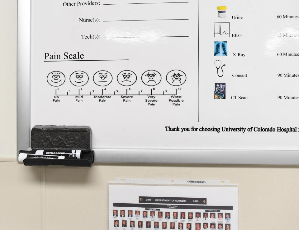 A pain scale hangs on the wall of a room during a tour University of Colorado Hospital's emergency department