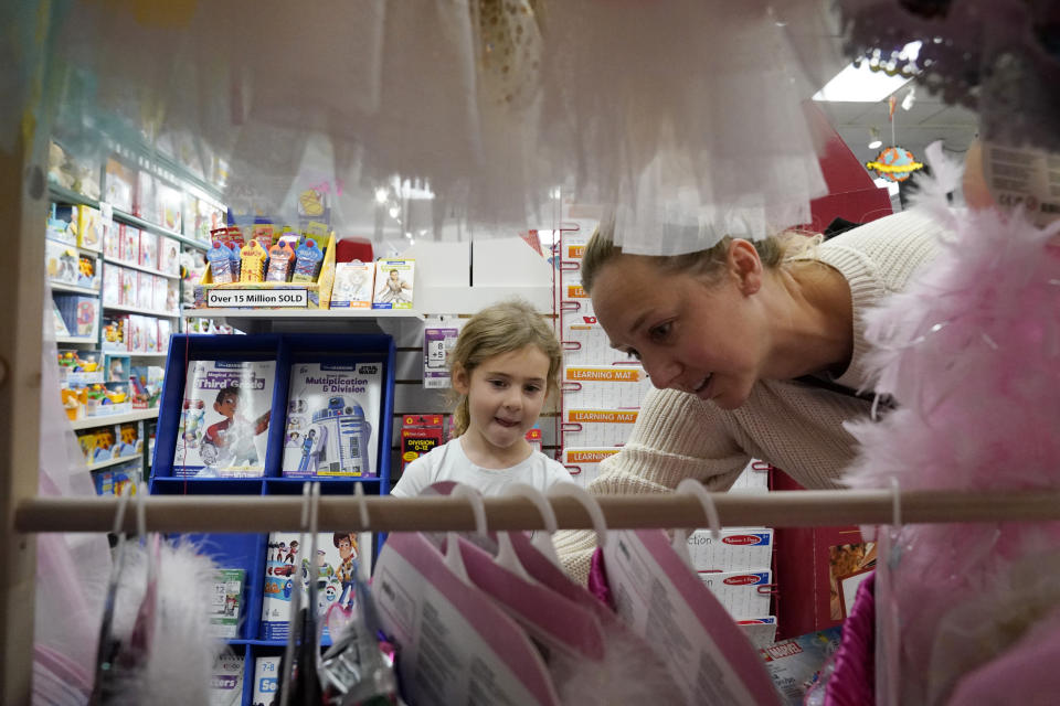 Quinn Byrne, 5 left, shops with her mother, Jamie Byrne, at a Learning Express store in Lake Zurich, Ill., Tuesday, Sept. 26, 2023. While still in its early phase, a growing number of toy marketers are embracing MESH — or mental, emotional and social health — as a designation for toys that teach kids skills like how to adjust to new challenges, resolve conflict, advocate for themselves, or solve problems. (AP Photo/Nam Y. Huh)