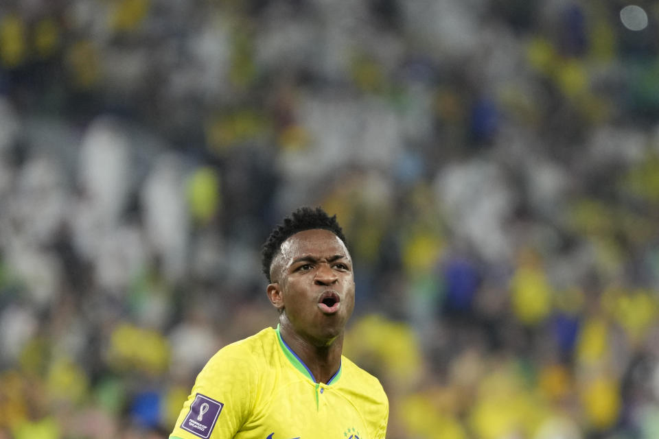 Brazil's Vinicius Junior celebrates after scoring his side's opening goal during the World Cup round of 16 soccer match between Brazil and South Korea at the Stadium 974 in Doha, Qatar, Monday, Dec. 5, 2022. (AP Photo/Jin-Man Lee)