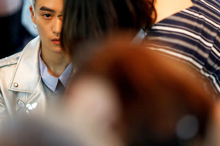 FILE PHOTO: A member of China's all-girl "boyband" FFC-Acrush is prepared for the band's maiden press conference in Beijing, China April 28, 2017. REUTERS/Damir Sagolj/File Photo