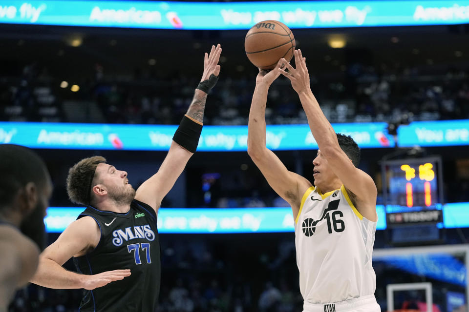 Utah Jazz forward Simone Fontecchio (16) shoots against Dallas Mavericks guard Luka Doncic (77) during the first half of an NBA basketball game in Dallas, Wednesday, Dec. 6, 2023. (AP Photo/LM Otero)