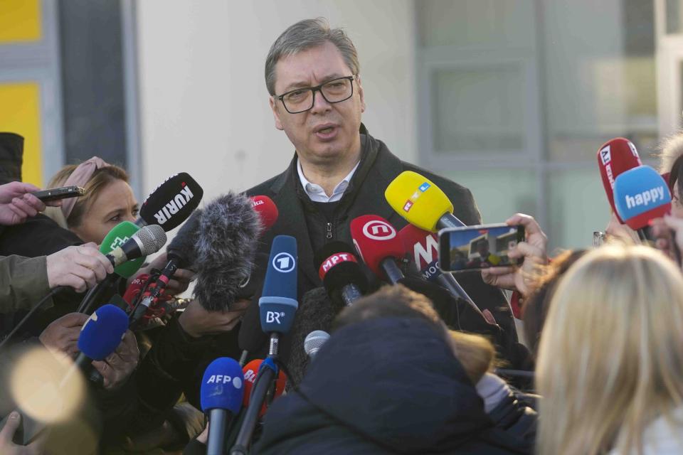 Serbian President Aleksandar Vucic speaks to the media after casting his ballot for a parliamentary and local election at a polling station in Belgrade, Serbia, Sunday, Dec. 17, 2023. The vote in Serbia pits Serbian President Aleksandar Vucic's governing Serbian Progressive Party, or SNS, against a pro-Western opposition coalition which is trying to undermine the firm grip on power the populists have maintained since 2012. (AP Photo/Darko Vojinovic)