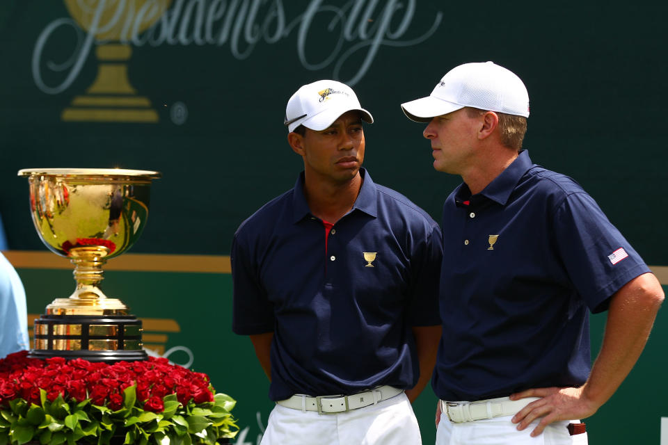 MELBOURNE, AUSTRALIA - NOVEMBER 17: (L-R) Tiger Woods of the U.S. Team and Steve Stricker of the U.S. Team stand alongside the Presidents Cup on the first hole tee box during the Day One Foursome Matches of the 2011 Presidents Cup at Royal Melbourne Golf Course on November 17, 2011 in Melbourne, Australia. (Photo by Ryan Pierse/Getty Images)