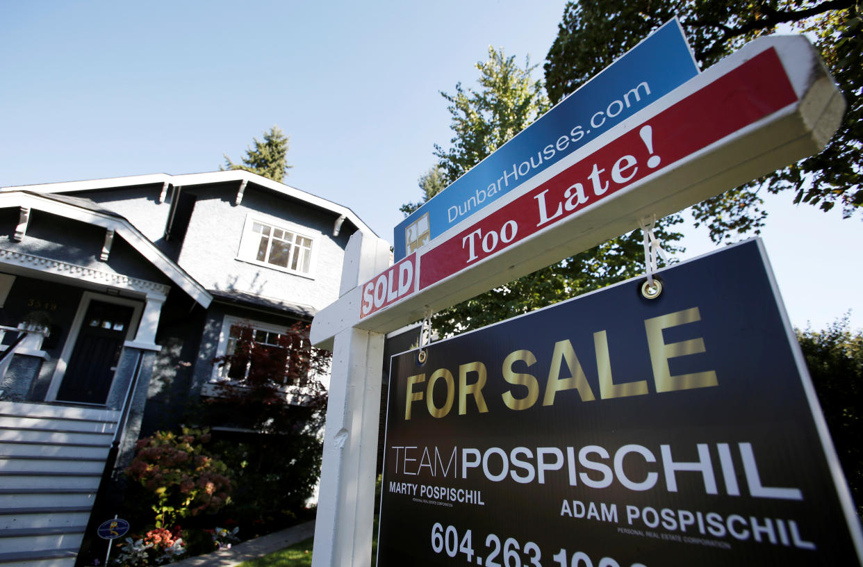 A for sale sign is pictured in front of a home in Vancouver, B.C., Sept. 22, 2016. (Canadian Press)