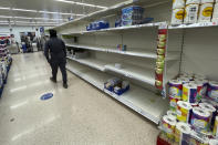 A view of empty shelves at a supermarket in London, Monday, Sept. 20, 2021. Retailers, manufacturers and food suppliers have reported disruptions due to a shortage of truck drivers linked to the pandemic and Britain's departure from the European Union, which has made it harder for many Europeans to work in the U.K. (AP Photo/Frank Augstein)