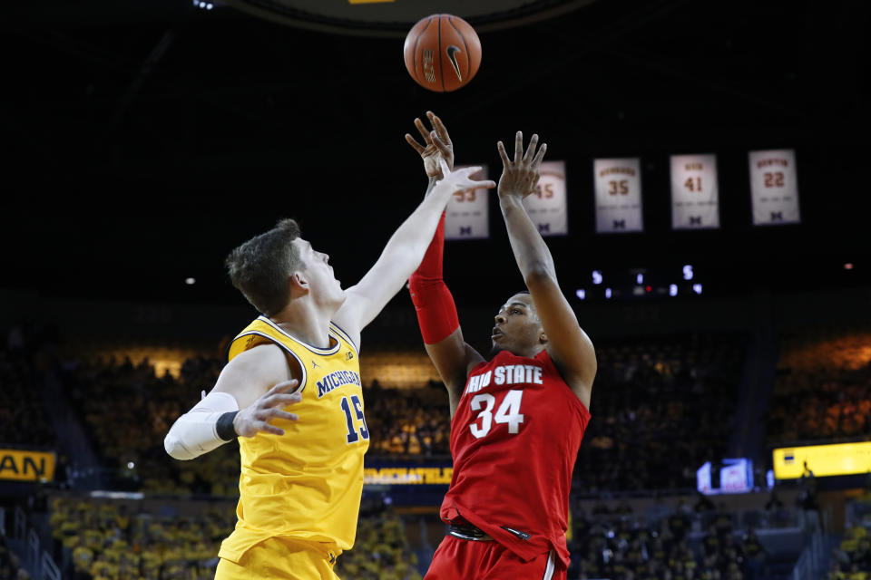 Ohio State forward Kaleb Wesson (34) shoots over Michigan center Jon Teske (15) in the first half of an NCAA college basketball game in Ann Arbor, Mich., Tuesday, Feb. 4, 2020. (AP Photo/Paul Sancya)