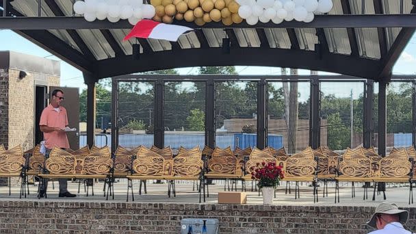 PHOTO: Sean Peacock stands with the 21 memorial benches he created for the victims of the May 24, 2022, deadly shooting at Robb Elementary School in Uvalde, Texas. (Sean Peacock)