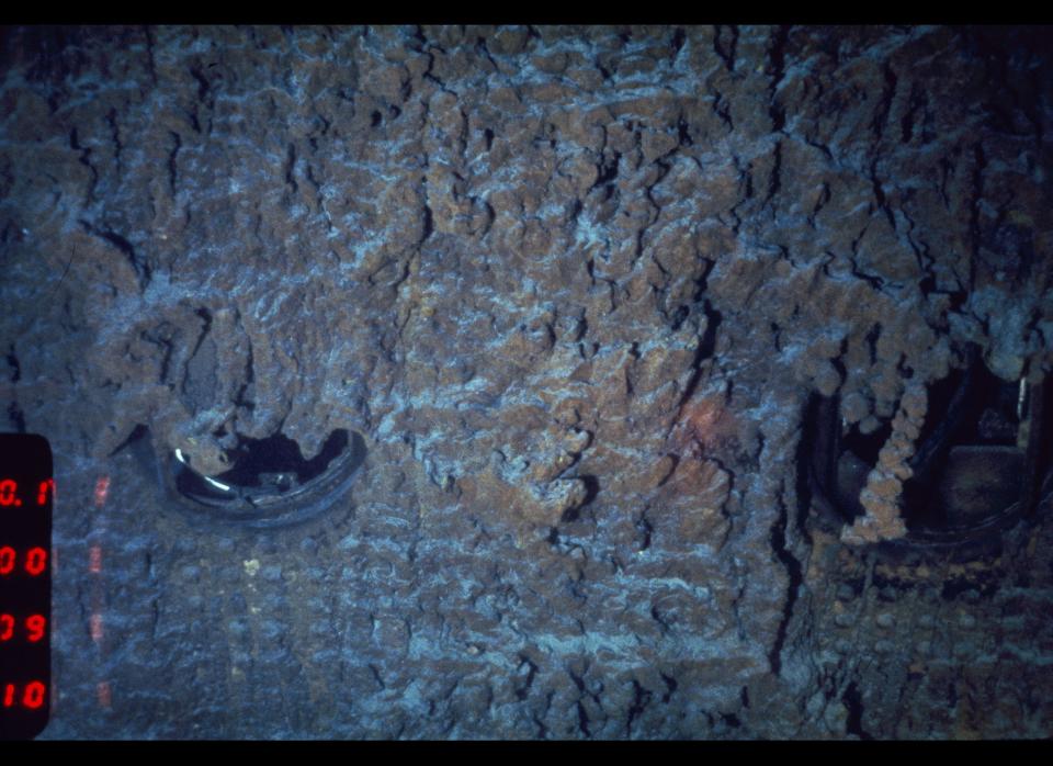 "Rust sickles," icicle-like structures of rust show the effect the years, underwater, have had as they obscure two portholes of the R.M.S. Titanic. 