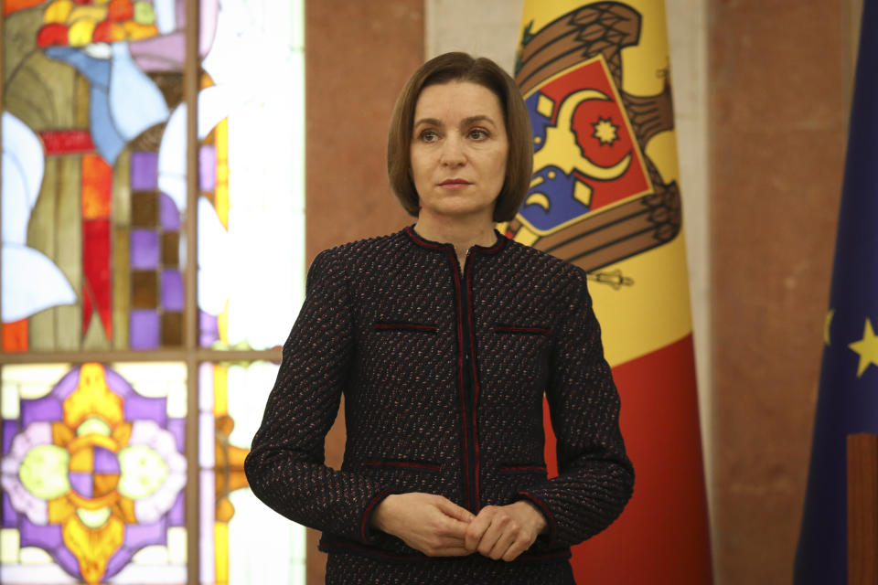 Moldovan President Maia Sandu pauses as Prime Minister designate Dorin Recean speaks after she appointed him to form a new government in Chisinau, Moldova, Friday, Feb 10, 2023. Moldova's government collapsed Friday as pro-Western Prime Minister Natalia Gavrilita resigned, adding to a series of crises that have gripped the small nation since Russia invaded its neighbor, Ukraine. (AP Photo/Aurel Obreja)