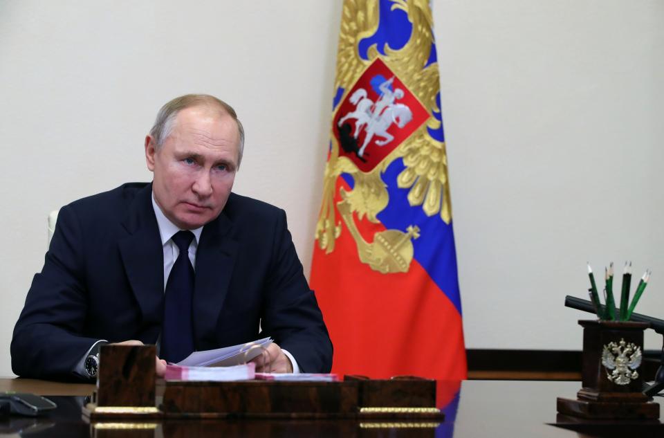 Russian President Vladimir Putin attends a meeting with leaders of the State Duma, the Lower House of the Russian Parliament factions via video conference residence at the Novo-Ogaryovo outside Moscow, Russia, Wednesday, Feb. 17, 2021. (Mikhail Klimentyev, Sputnik, Kremlin Pool Photo via AP)