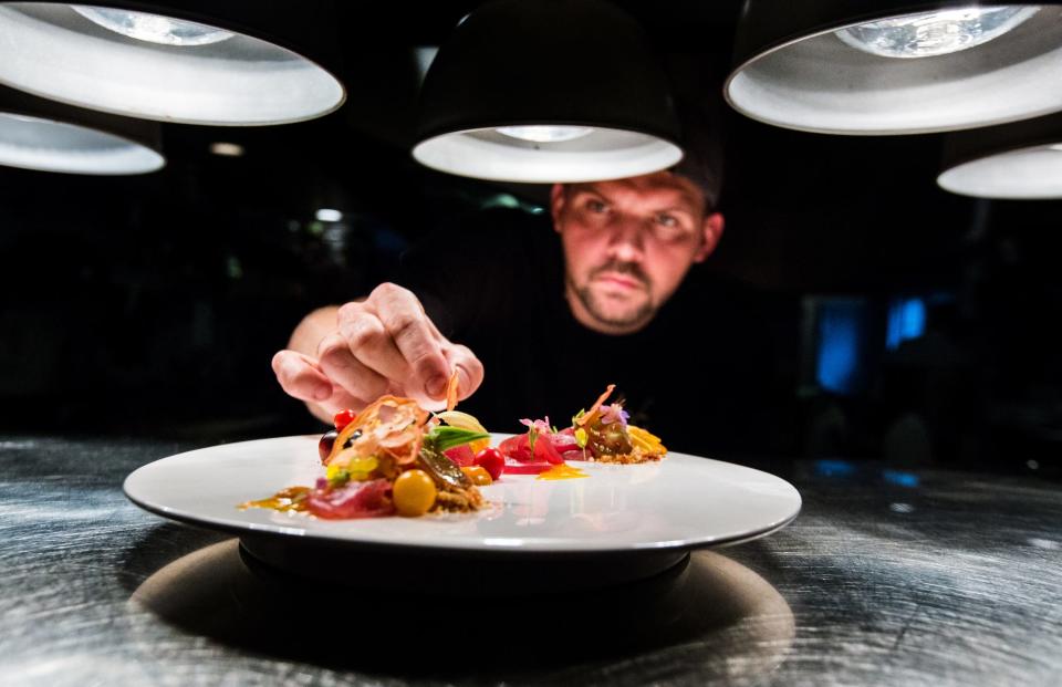 Chef Bill Hoffman prepares his signature tomato dish at The House of William and Merry Restaurant in Hockessin.