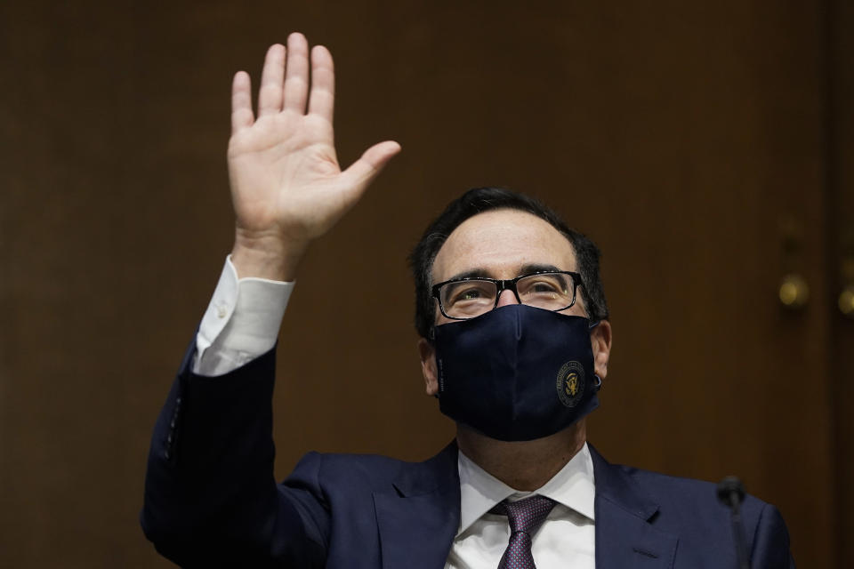 WASHINGTON, DC - SEPTEMBER 24: U.S. Treasury Secretary Steven Mnuchin waves as he arrives for a Senate Banking Committee hearing on Capitol Hill on September 24, 2020 in Washington, DC. Mnuchin and Federal Reserve Board Chairman Jerome Powell are testifying about the CARES Act and the economic effects of the coronavirus (COVID-19) pandemic. (Photo by Drew Angerer/Getty Images)