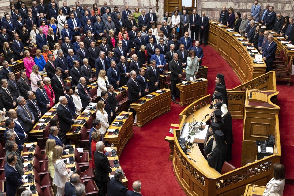 Greek lawmakers attend a swearing in ceremony at the parliament in Athens, Greece, Sunday, May 28, 2023. Newly elected Greek lawmakers were sworn in Sunday, but the Parliament elected on May 21, in which no party achieved an overall majority, could be dissolved as early as Monday and a new election campaign start for another election, on June 25. The lawmakers will elect the speaker and the deputies Monday morning. (AP Photo/Yorgos Karahalis)