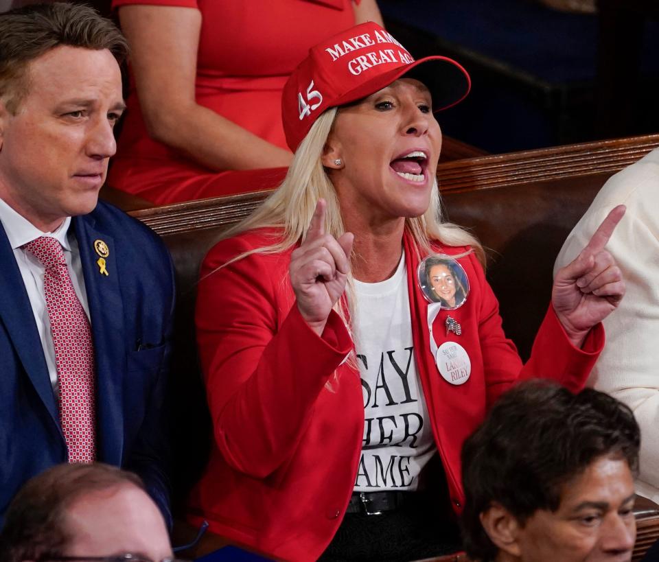 Rep Marjorie Taylor Greene, R-Ga., yells as President Joe Biden delivers the State of the Union address to Congress at the U.S. Capitol in Washington on Thursday.