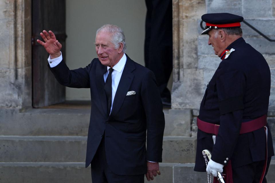 Britain’s King Charles III waves as he arrives to visit Cardiff Castle (AFP via Getty Images)