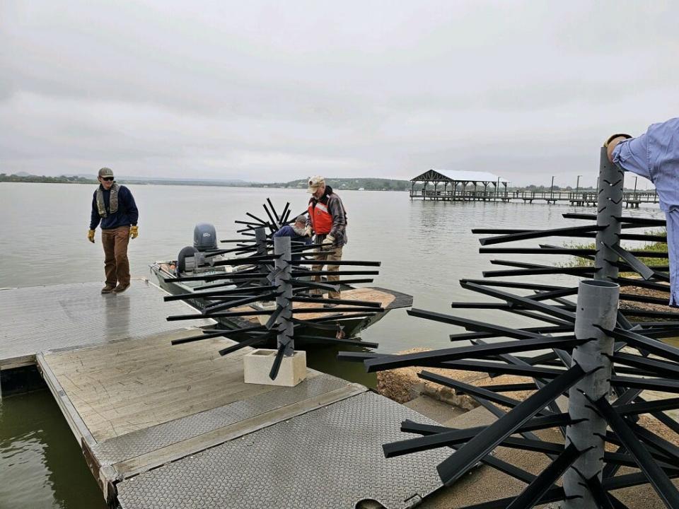 Forty fish habitats were placed in Lake Nasworthy, expected to attract more fish to the new pier.