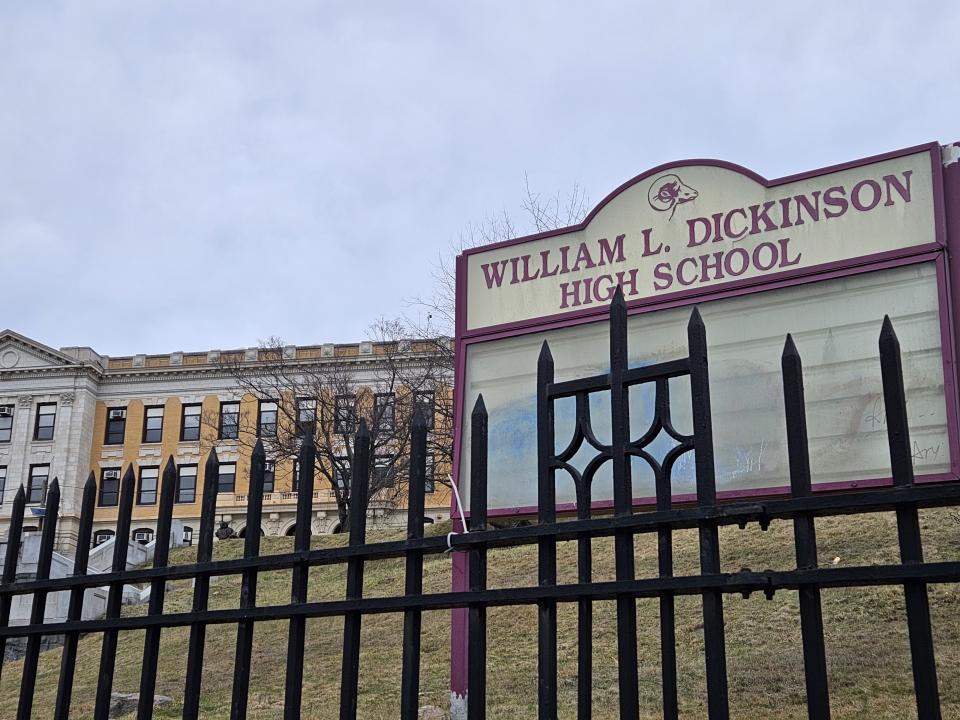 <p>Galaxy S23 Plus camera sample: A closer shot of a school on a slight hill with the American flag in the background and a sign in the foreground saying "William L. Dickinson High School."</p>
