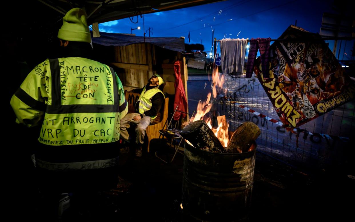 Yellow vest protesters have commandeered toll booths and roundabouts as part of their protests - AFP