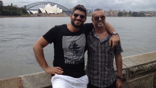 George Michael (right) with his then-boyfriend, Queensland-born Fadi Fawaz, in Sydney in 2012. Source: Twitter