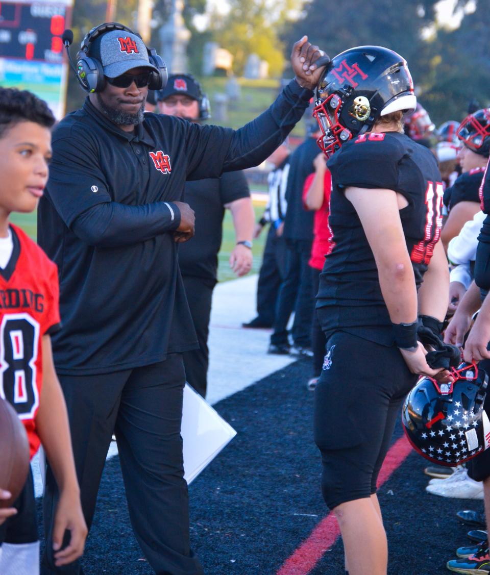 Marion Harding head football coach Demetrius Ross walks the sideline during a home game with Galion last season.