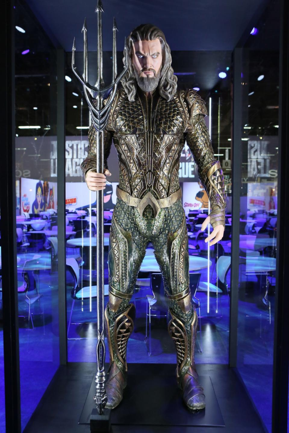 <p>Our best look yet at the sea king’s Atlantean armor featuring the iconic “A” belt buckle and the golden/green color scheme from the comics. Don’t get on the business end of that trident, er, <em>quintdent</em>. (Credit: Warner Bros.) </p>