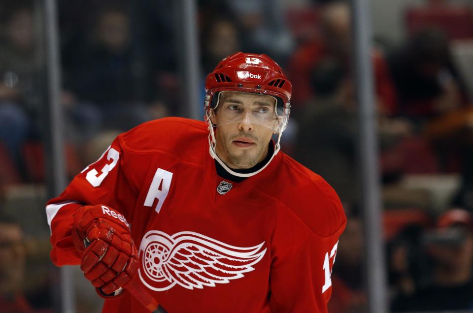 FILE - In this Nov. 7, 2013 file photo, Detroit Red Wings center Pavel Datsyuk of Russia skates against the Dallas Stars in the first period of an NHL hockey game in Detroit. Datsyukm, who has struggled through the last two months with an apparent left knee injury, says he is healthy for the 2014 Winter Olympics after joining the Russian hockey team for its second full practice on Tuesday, Feb. 11, 2014 in Sochi, Russia. (AP Photo/Paul Sancya, File)