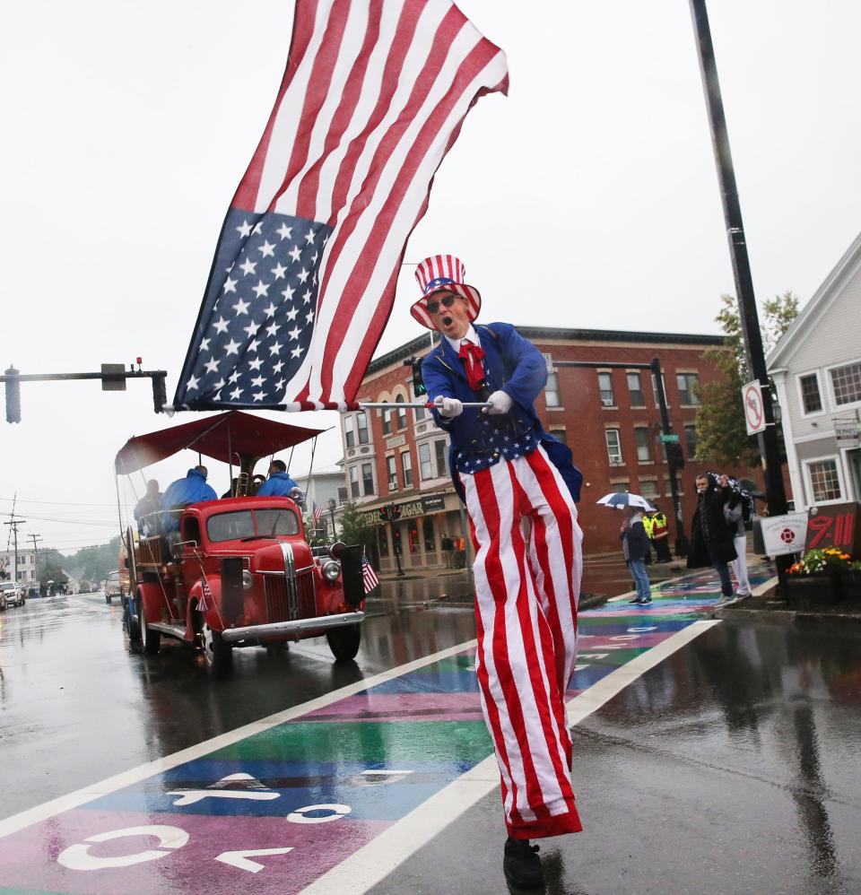 An Uncle Sam character hams it up for the camera as he struts down Central Avenue during the 2023 Dover 400th Anniversary Parade on Sunday, July 2. 