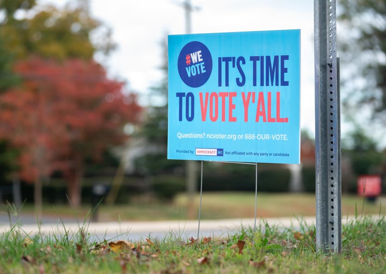 A sign encourages people to vote in Charlotte, N.C., ahead of the 2022 U.S. midterm elections. <a href="https://www.gettyimages.com/detail/news-photo/sign-made-by-the-group-democracy-nc-reads-its-time-to-vote-news-photo/1244530643?phrase=y'all&adppopup=true" rel="nofollow noopener" target="_blank" data-ylk="slk:Sean Rayford/Getty Images;elm:context_link;itc:0;sec:content-canvas" class="link "> Sean Rayford/Getty Images</a>