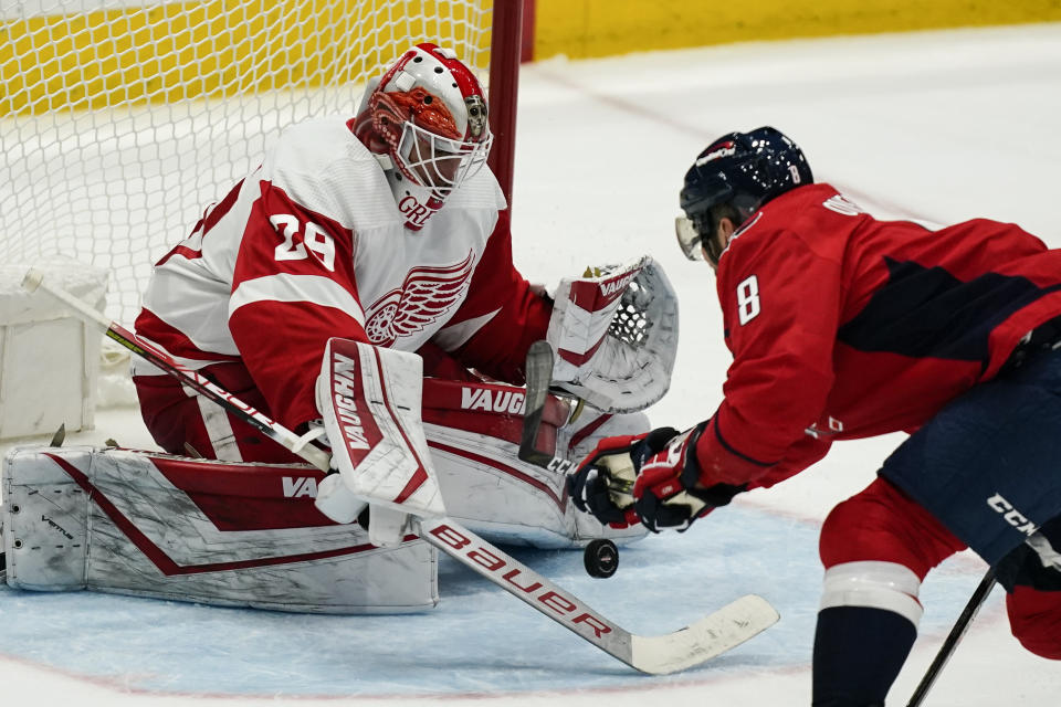 Detroit Red Wings goaltender Thomas Greiss (29) blocks a shot by Washington Capitals left wing Alex Ovechkin (8) in the third period of an NHL hockey game, Wednesday, Oct. 27, 2021, in Washington. The Red Wings won 3-2 in overtime. (AP Photo/Alex Brandon)