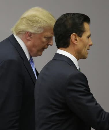 U.S. Republican presidential nominee Donald Trump and Mexico's President Enrique Pena Nieto arrive for a press conference at the Los Pinos residence in Mexico City, Mexico, August 31, 2016. REUTERS/Henry Romero