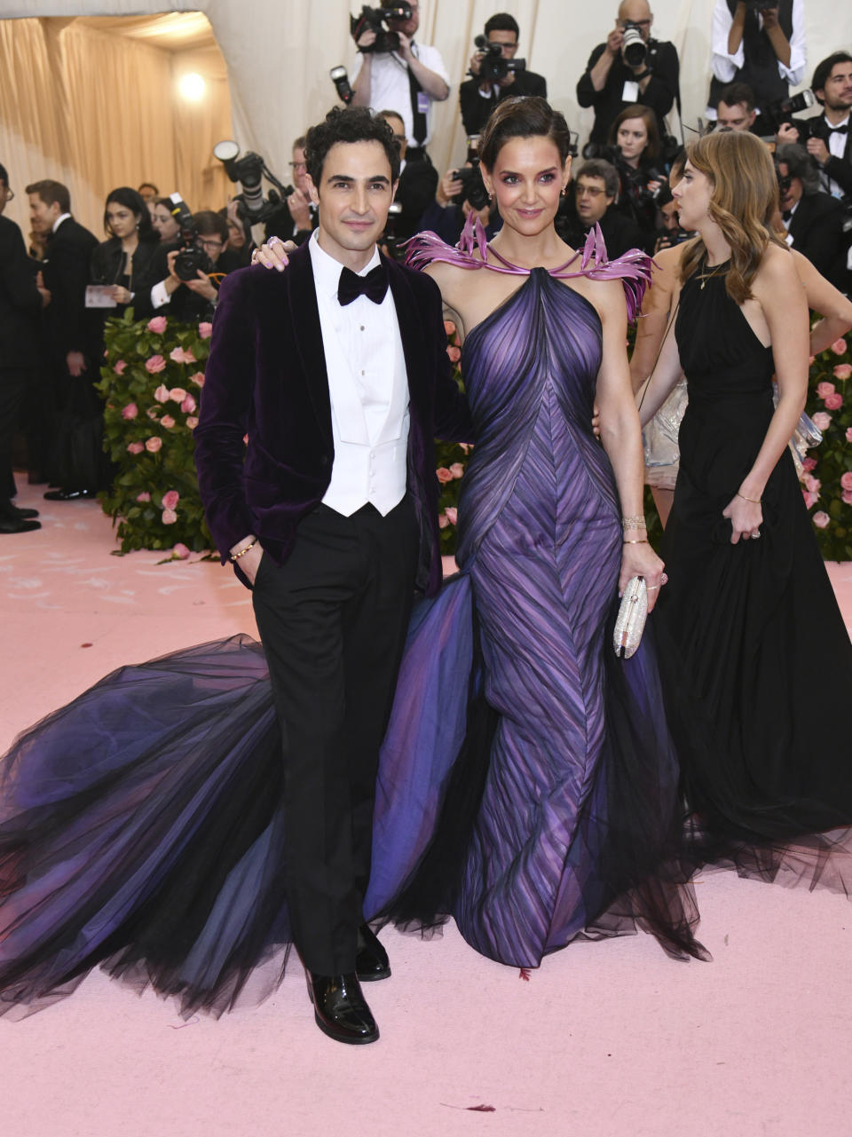 FILE - In this May 6, 2019, file photo, designer Zac Posen, left, and Katie Holmes attend The Metropolitan Museum of Art's Costume Institute benefit gala celebrating the opening of the "Camp: Notes on Fashion" exhibition in New York. Posen is shutting down his namesake label. Posen has been a red carpet favorite for close to two decades. He’s known for glamorous, body-hugging gowns, often with long trains or big, flamboyant ruffles, for stars like Holmes and Rihanna. (Photo by Charles Sykes/Invision/AP, File)