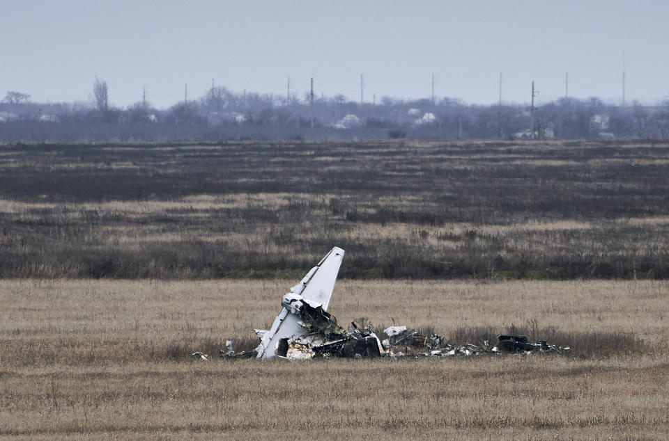 Fragments of a military plane are seen near Kherson, Ukraine, Saturday, Jan. 7, 2023. (AP Photo/Libkos)