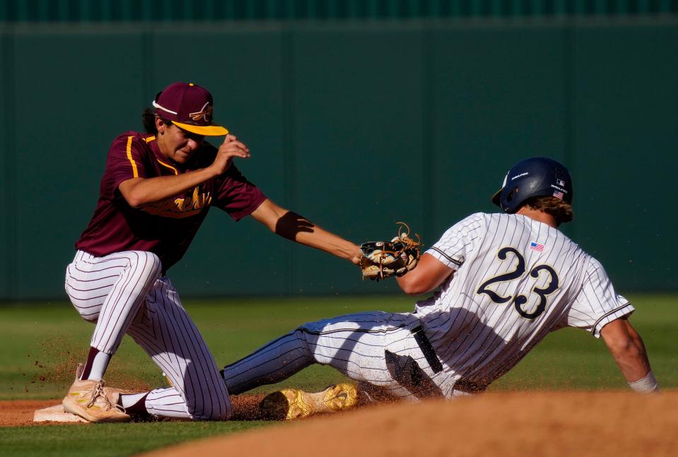 Casteel Ryan Harwood (23) slides safely into second base against Nogales Luis Martin Romero (1) during a state playoff game at Tempe Diablo Stadium in Phoenix on May 4, 2023.