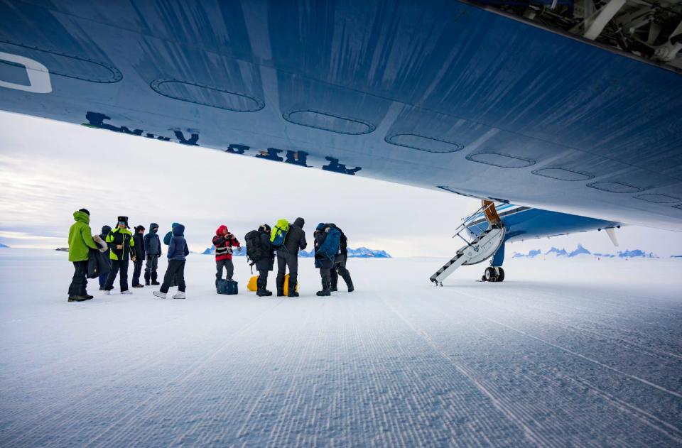 Tourists on Wolf's Fang Runway in Antarctica.