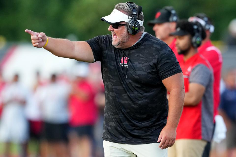 Lakota West Firebirds head coach Tom Bolden instructs the team in the first quarter during a high school football game against the St. Xavier Bombers, Friday, Aug. 19, 2022, at Firebirds Stadium in West Chester Township, Ohio.