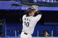 Japan's Takuya Kai follows through after hitting during the tenth inning of a baseball game against the United States at the 2020 Summer Olympics, Monday, Aug. 2, 2021, in Yokohama, Japan. Japan won 7-6. (AP Photo/Sue Ogrocki)